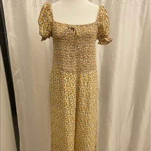 Anthropologie yellow floral jumpsuit size 6, worn once, like new.